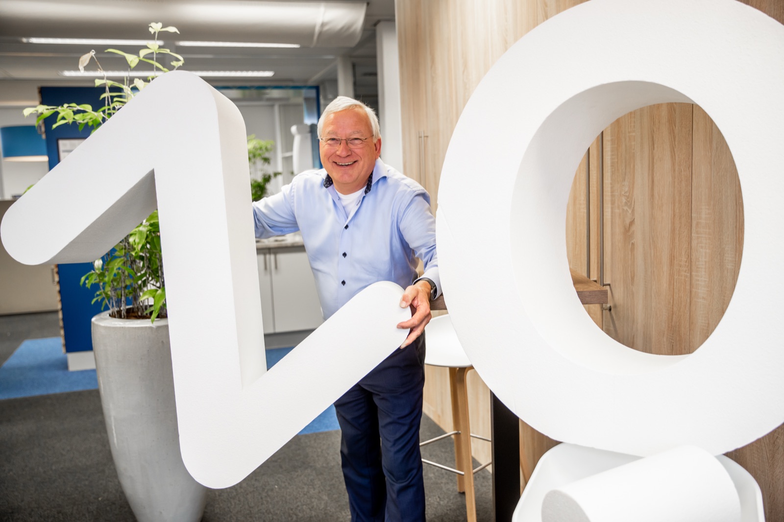 Employee with the VE letters at their desk