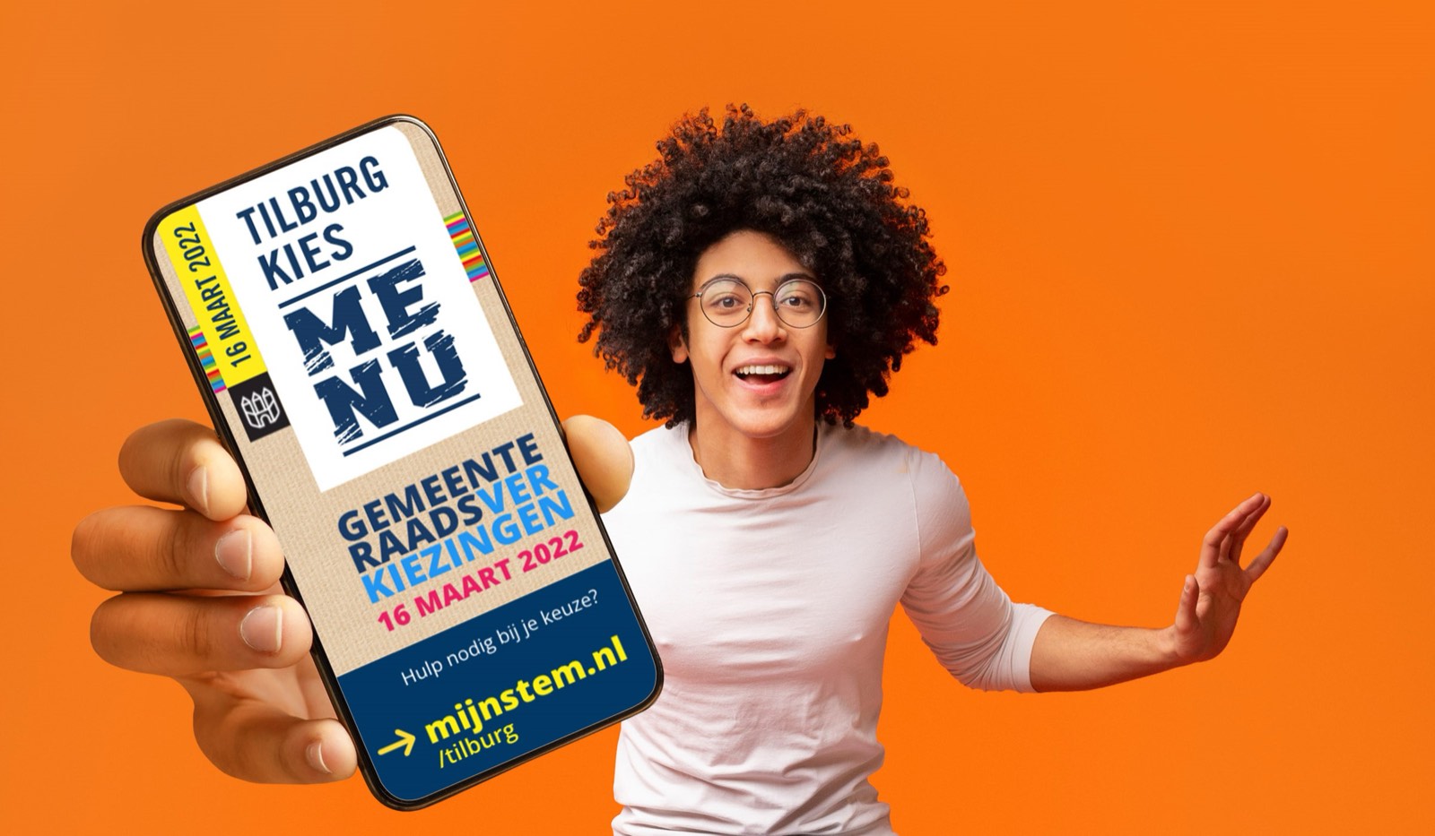 Tilburg kies ME NU campaign visual: a young person holding a phone with the label for the municipal elections of 16 March 2022.